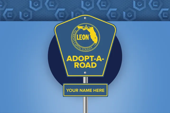 Sign showing the phrase "Adopt-A-Road"