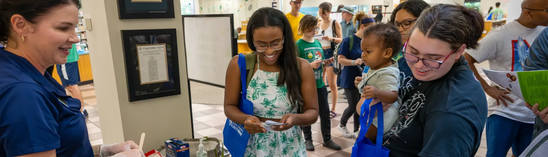 Library customers choosing seeds from a "Seed Library" event